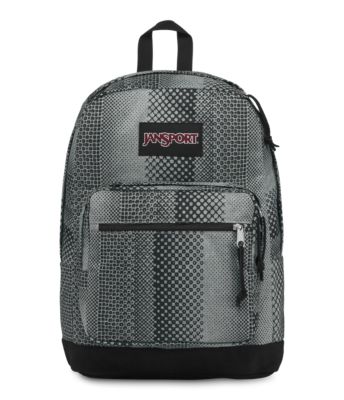 The JanSport Right Pack Expressions features a variety of prints, including animal prints, and colors on unique fabrications. This backpack includes signature suede leather bottom, 15 inch laptop sleeve and front pocket with organizer.